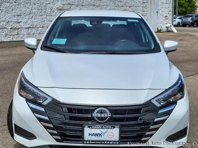 Photo of 2025 Aspen White Tricoat Nissan Versa