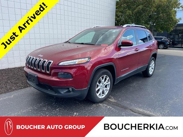Photo of 2014 Deep Cherry Red Crystal Pearlcoat Jeep Cherokee