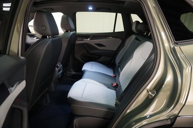Photo of 2025 Avocado Green w/Deep Black Roof Volkswagen Tiguan