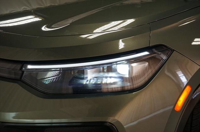 Photo of 2025 Avocado Green w/Deep Black Roof Volkswagen Tiguan