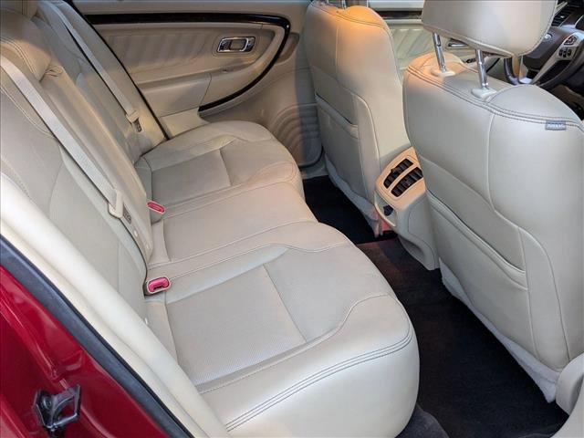 Photo of 2015 Ruby Red Metallic Tinted Clearcoat Ford Taurus