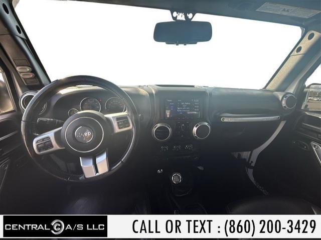 Photo of 2016 Bright White Clearcoat Jeep Wrangler Unlimited