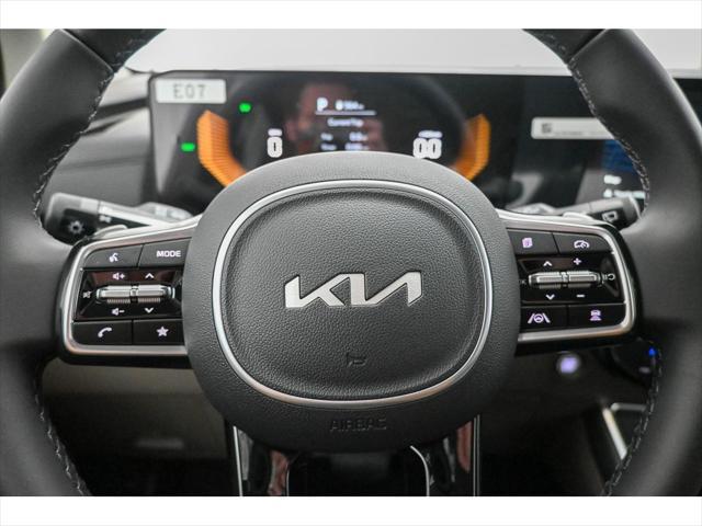 Photo of 2025 Aurora Black Pearl Kia Carnival Hybrid