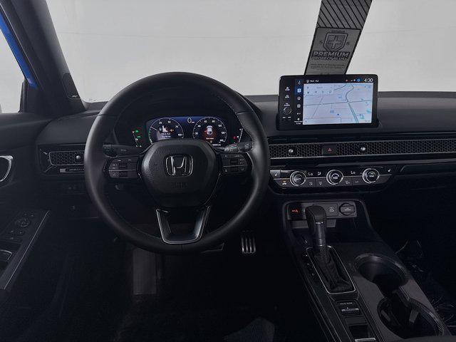 Photo of 2025 Boost Blue Pearl Honda Civic Hybrid
