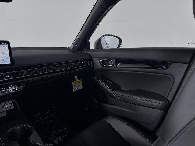 Photo of 2025 Boost Blue Pearl Honda Civic Hybrid