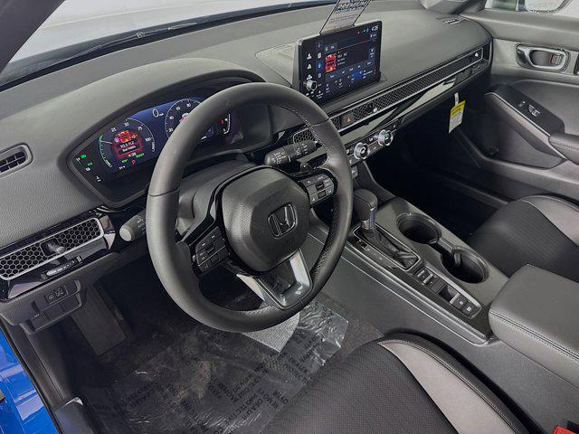 Photo of 2025 Boost Blue Pearl Honda Civic Hybrid