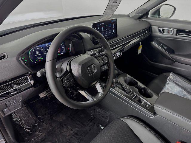 Photo of 2025 Sonic Gray Pearl Honda Civic Hybrid