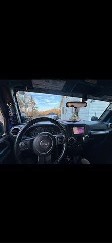 Photo of 2015 Blue Jeep Wrangler
