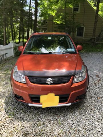 Photo of 2008 Orange Suzuki SX4
