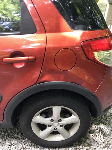 Photo of 2008 Orange Suzuki SX4