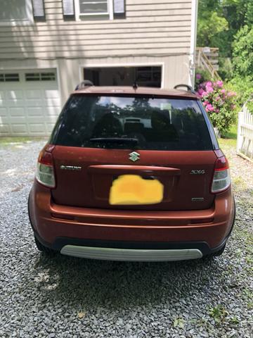 Photo of 2008 Orange Suzuki SX4