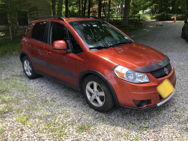 Photo of 2008 Orange Suzuki SX4