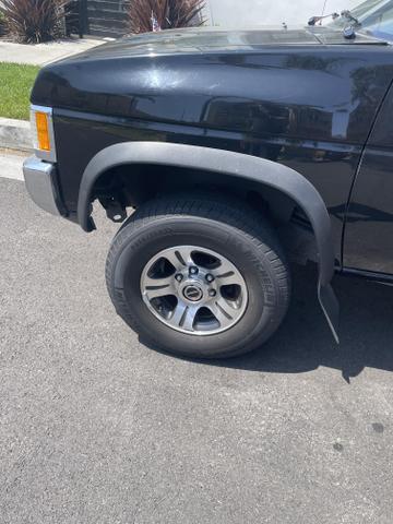 Photo of 1996 Black Nissan Pickup Truck