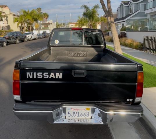 Photo of 1996 Black Nissan Pickup Truck