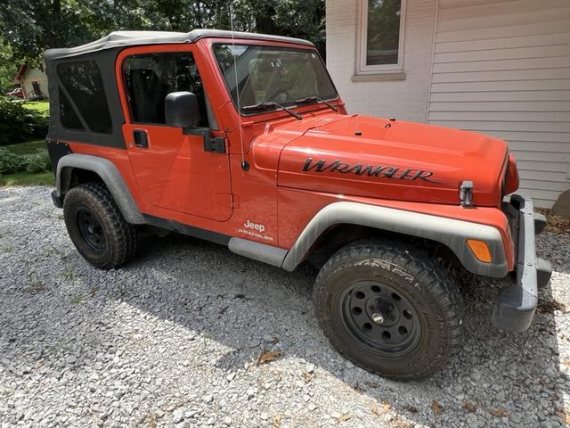 Photo of 2006 Orange Jeep Wrangler