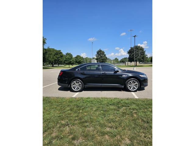Photo of 2013 Black Ford Taurus