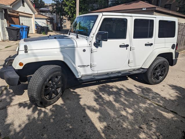 Photo of 2014 White Jeep Wrangler Unlimited