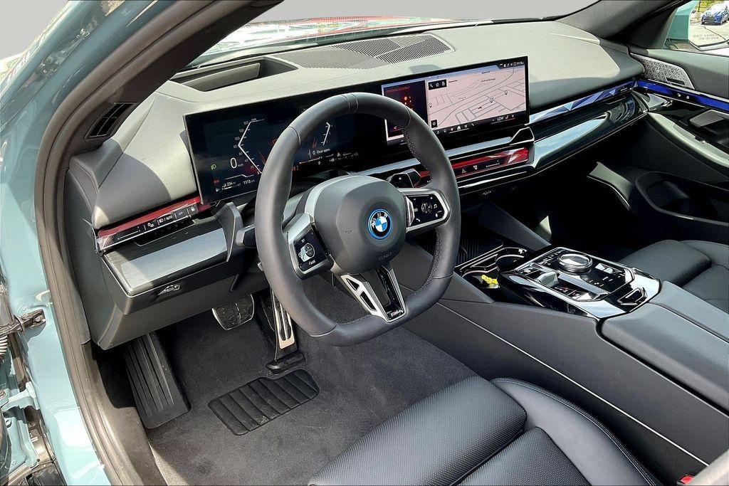 used 2025 BMW 550e car, priced at $70,148