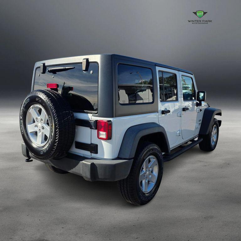 used 2015 Jeep Wrangler Unlimited car, priced at $13,988