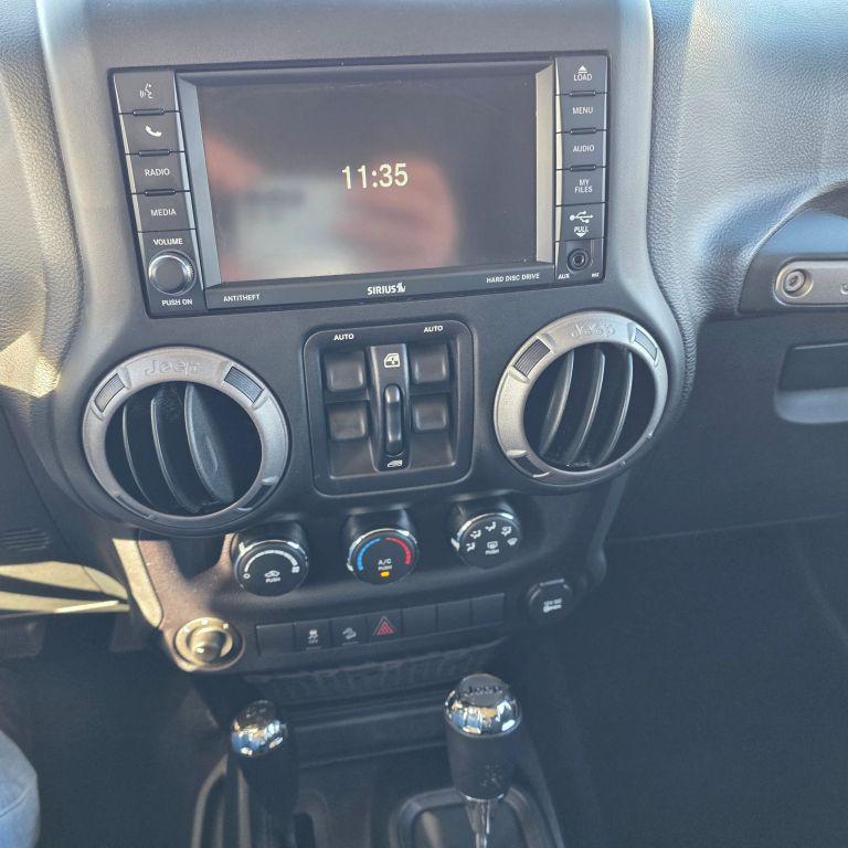 used 2015 Jeep Wrangler Unlimited car, priced at $13,988