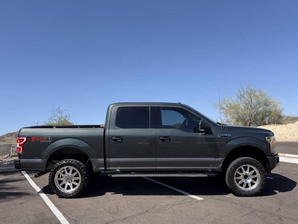 used 2018 Ford F-150 car, priced at $14,500