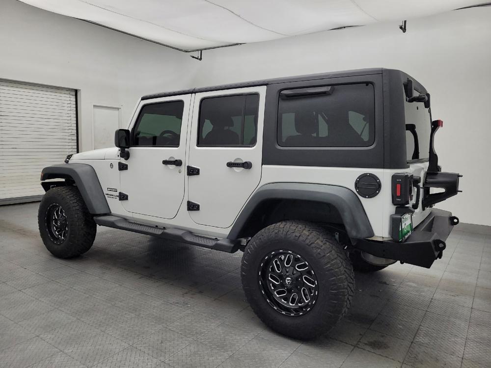used 2014 Jeep Wrangler Unlimited car, priced at $23,095