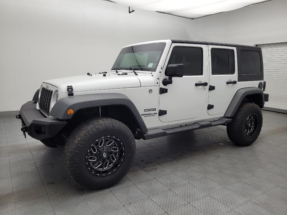 used 2014 Jeep Wrangler Unlimited car, priced at $23,095