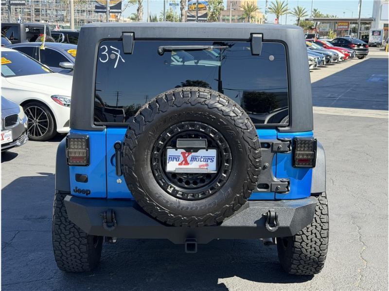 used 2015 Jeep Wrangler Unlimited car, priced at $15,395