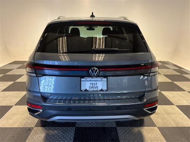 used 2025 Volkswagen Taos car, priced at $24,197