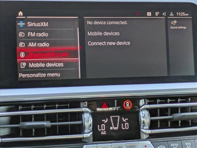 used 2023 BMW M4 car, priced at $70,564