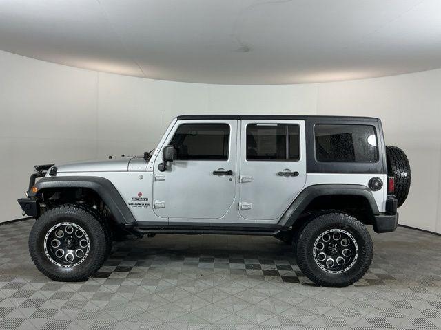 used 2011 Jeep Wrangler Unlimited car, priced at $15,971