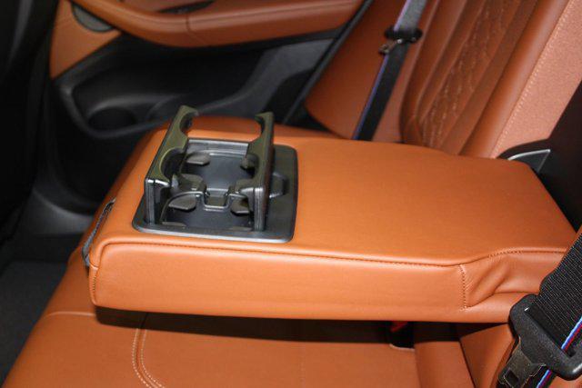 new 2025 BMW X4 M car, priced at $97,930