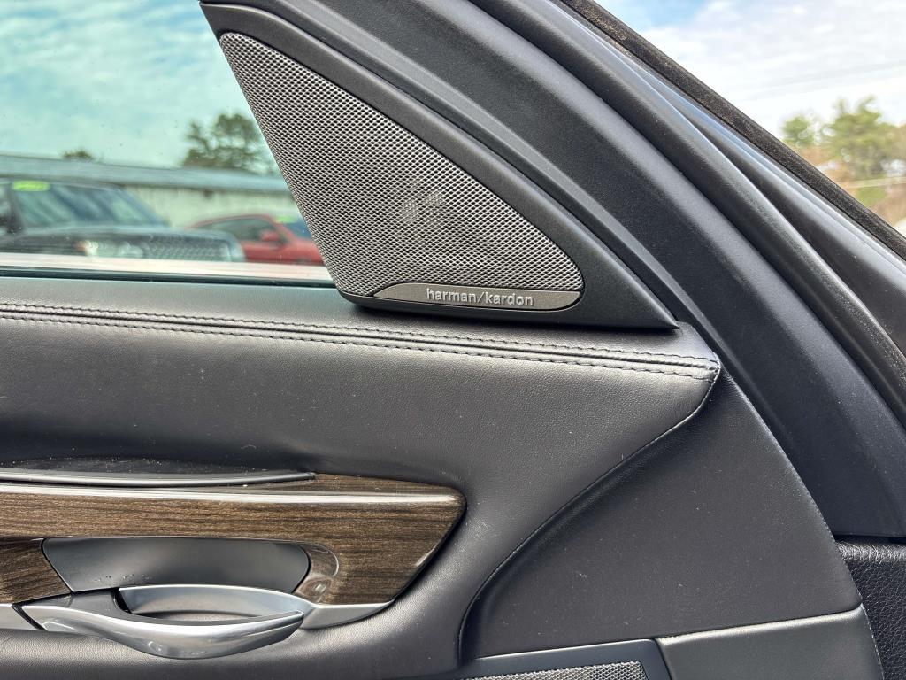 used 2015 BMW 750 car, priced at $16,450