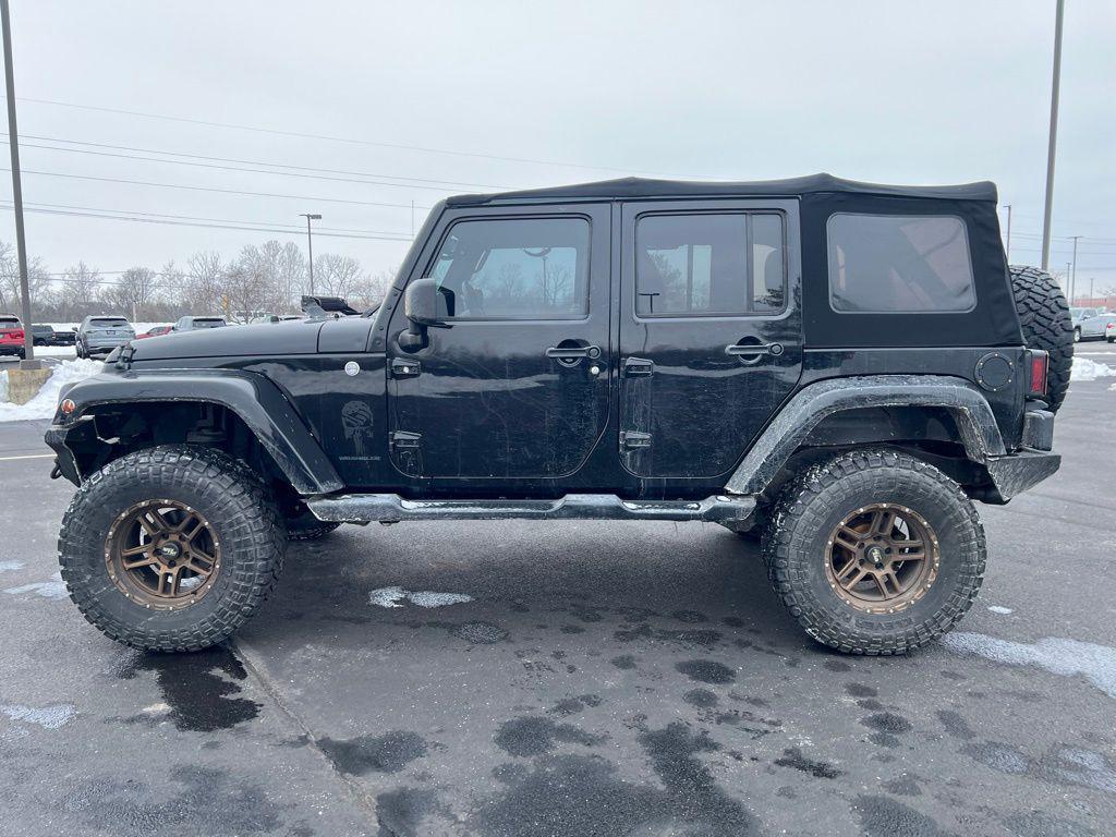 used 2014 Jeep Wrangler Unlimited car, priced at $14,421
