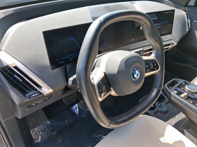 used 2024 BMW iX car, priced at $47,097