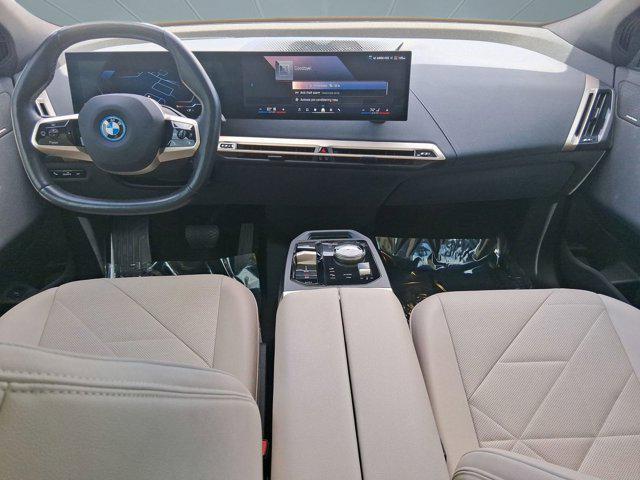 used 2024 BMW iX car, priced at $47,097