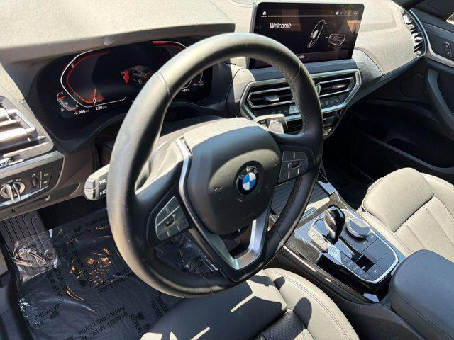 used 2025 BMW X4 car, priced at $51,097