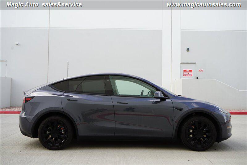 used 2023 Tesla Model Y car, priced at $27,990