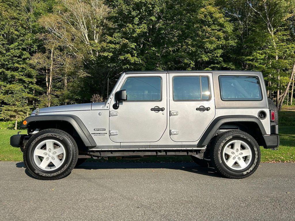 used 2014 Jeep Wrangler Unlimited car, priced at $19,366