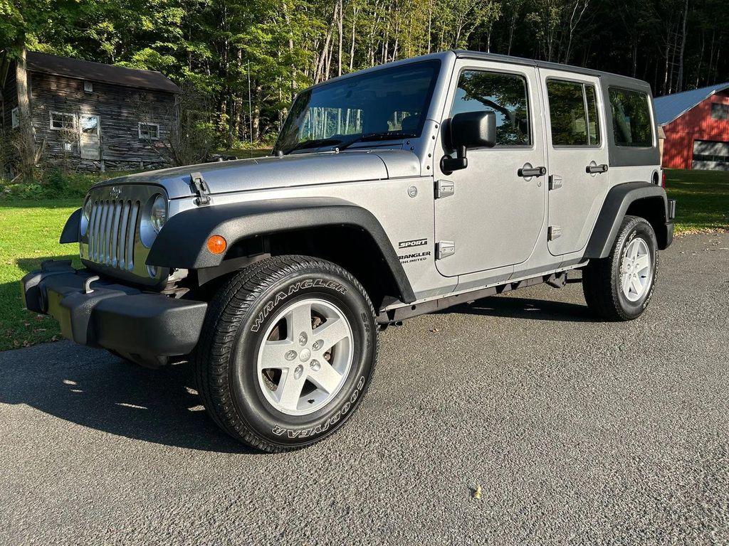 used 2014 Jeep Wrangler Unlimited car, priced at $19,366
