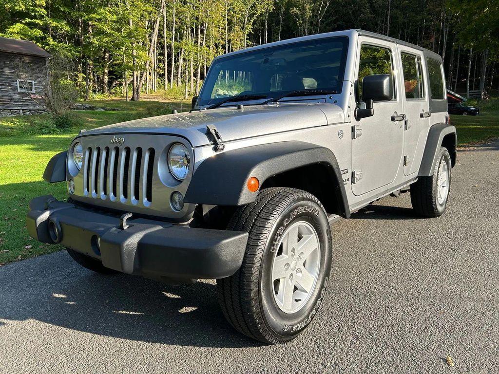 used 2014 Jeep Wrangler Unlimited car, priced at $19,366