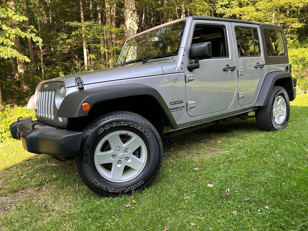 used 2014 Jeep Wrangler Unlimited car, priced at $19,366