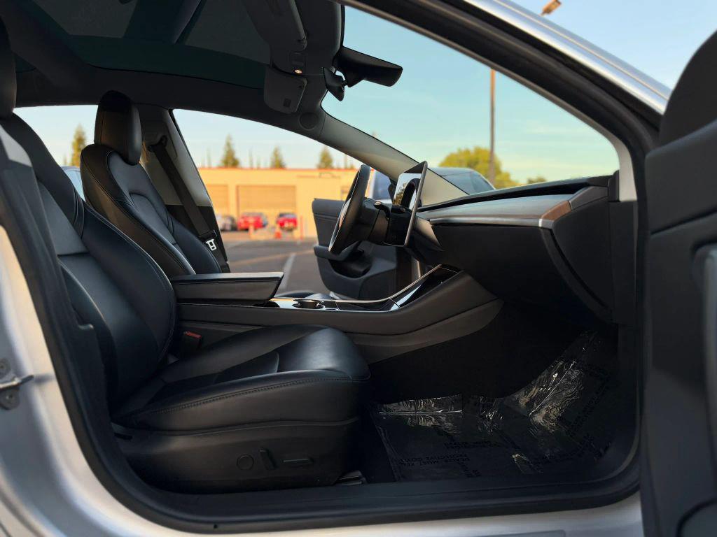 used 2018 Tesla Model 3 car, priced at $16,999