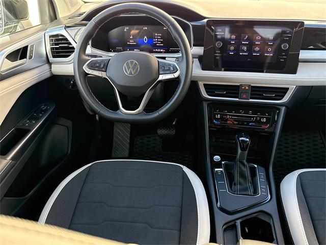 used 2025 Volkswagen Taos car, priced at $24,116