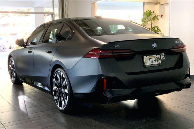 used 2025 BMW 550e car, priced at $86,575