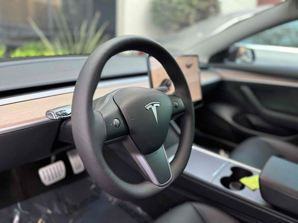 used 2023 Tesla Model 3 car, priced at $32,990