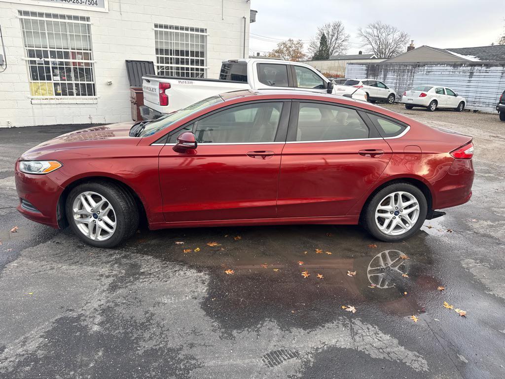 used 2014 Ford Fusion car, priced at $3,990