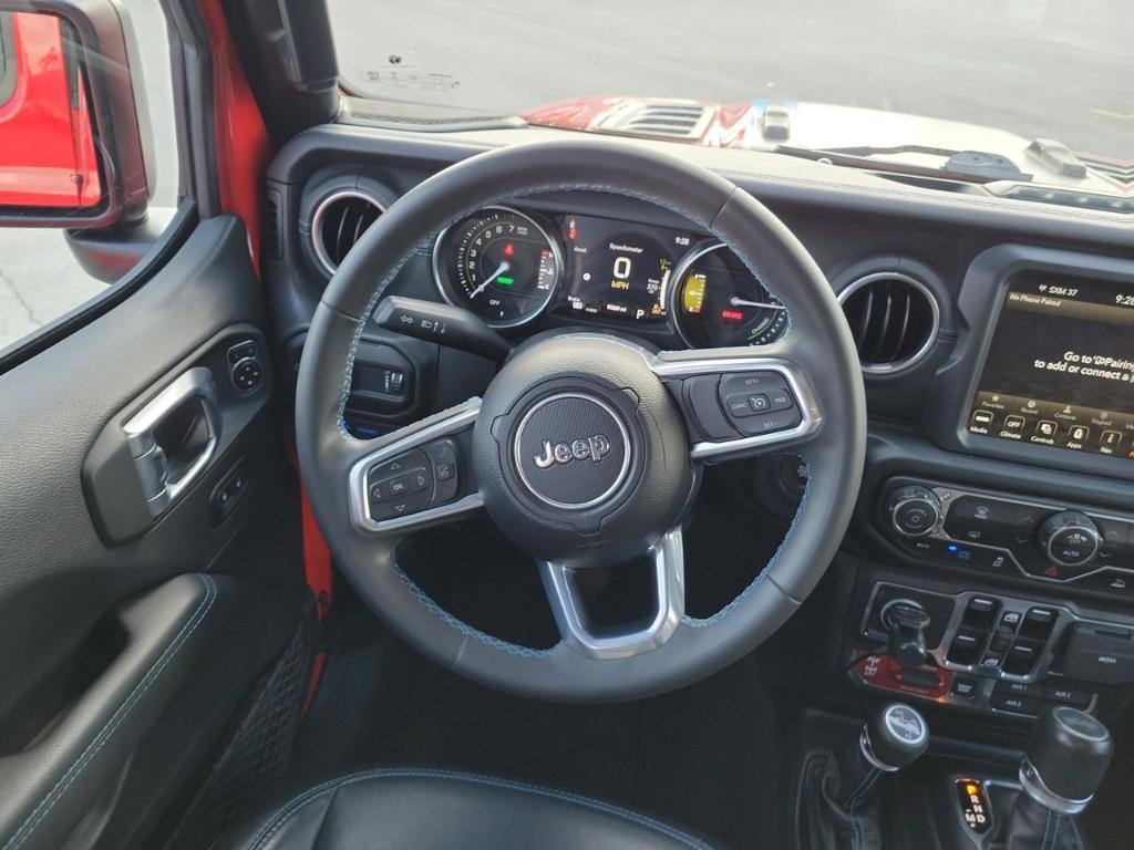 used 2023 Jeep Wrangler 4xe car, priced at $27,529