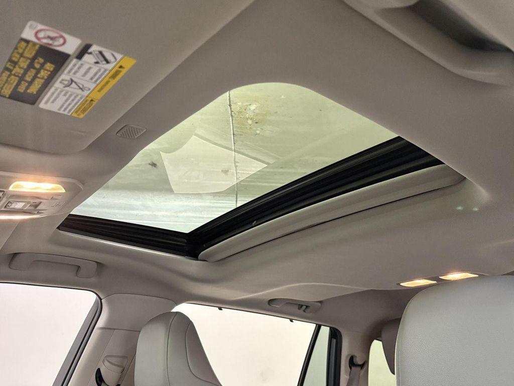 used 2021 Toyota Highlander Hybrid car, priced at $28,500