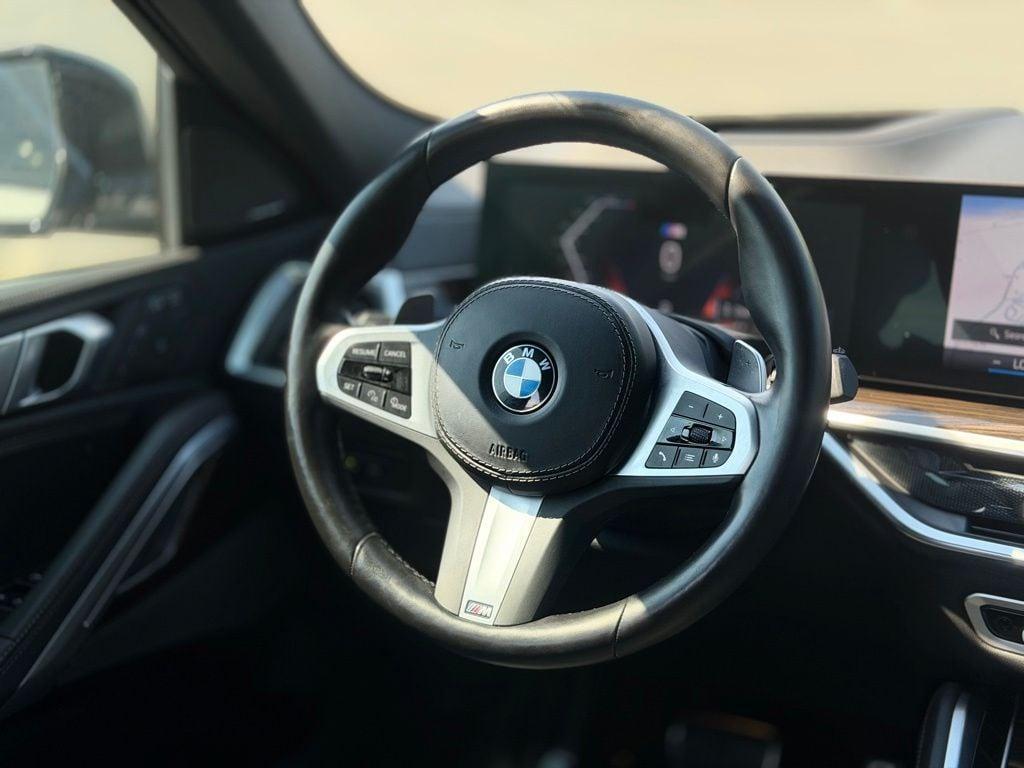 used 2024 BMW X6 car, priced at $67,045